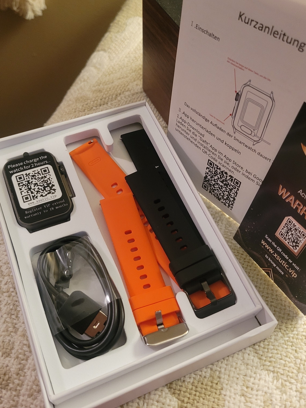 Smartwatch with Interchangeable Orange and Black Bands Health Vitals